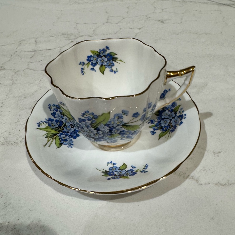 Vintage tea cup and saucer: Forget Me Not" floral pattern designed by Regency